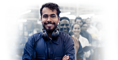 Man, arms crossed, with hearing protection